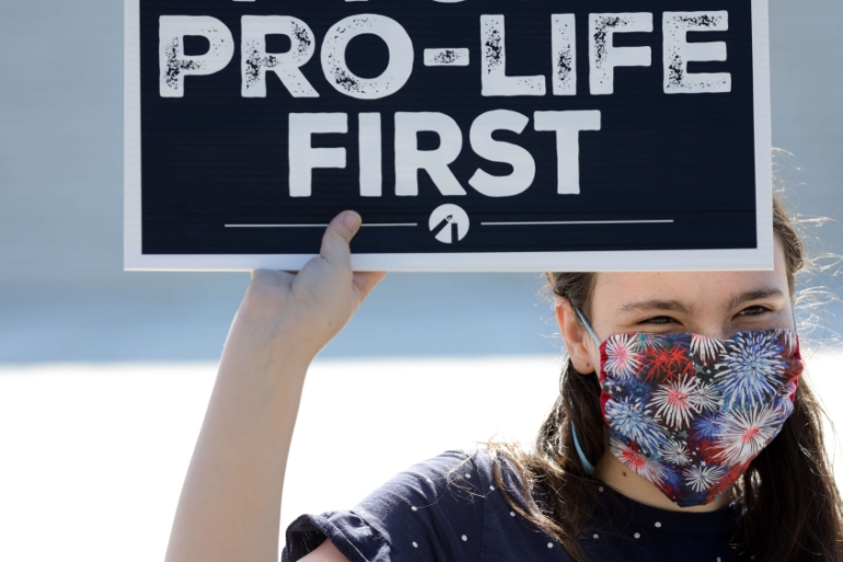 A 'pro-life' activist holds a sign during a demonstration in front of the US Supreme Court on June 29, 2020 in Washington, DC [Alex Wong/Getty Images/AFP]